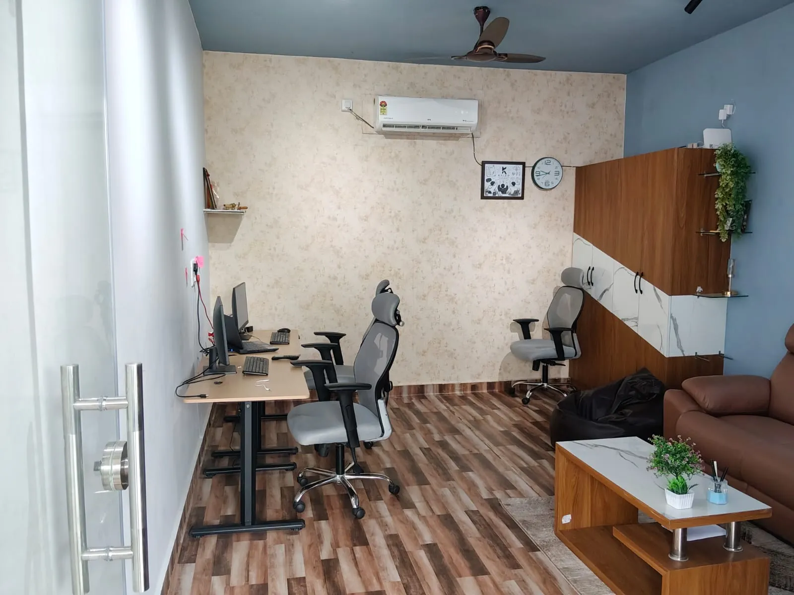MokshiTech office interior with workstations and a seating area