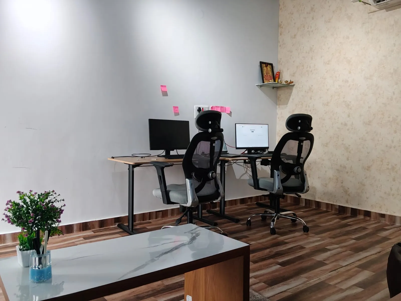 Work desks, monitors and seating inside MokshiTech's Ballari office