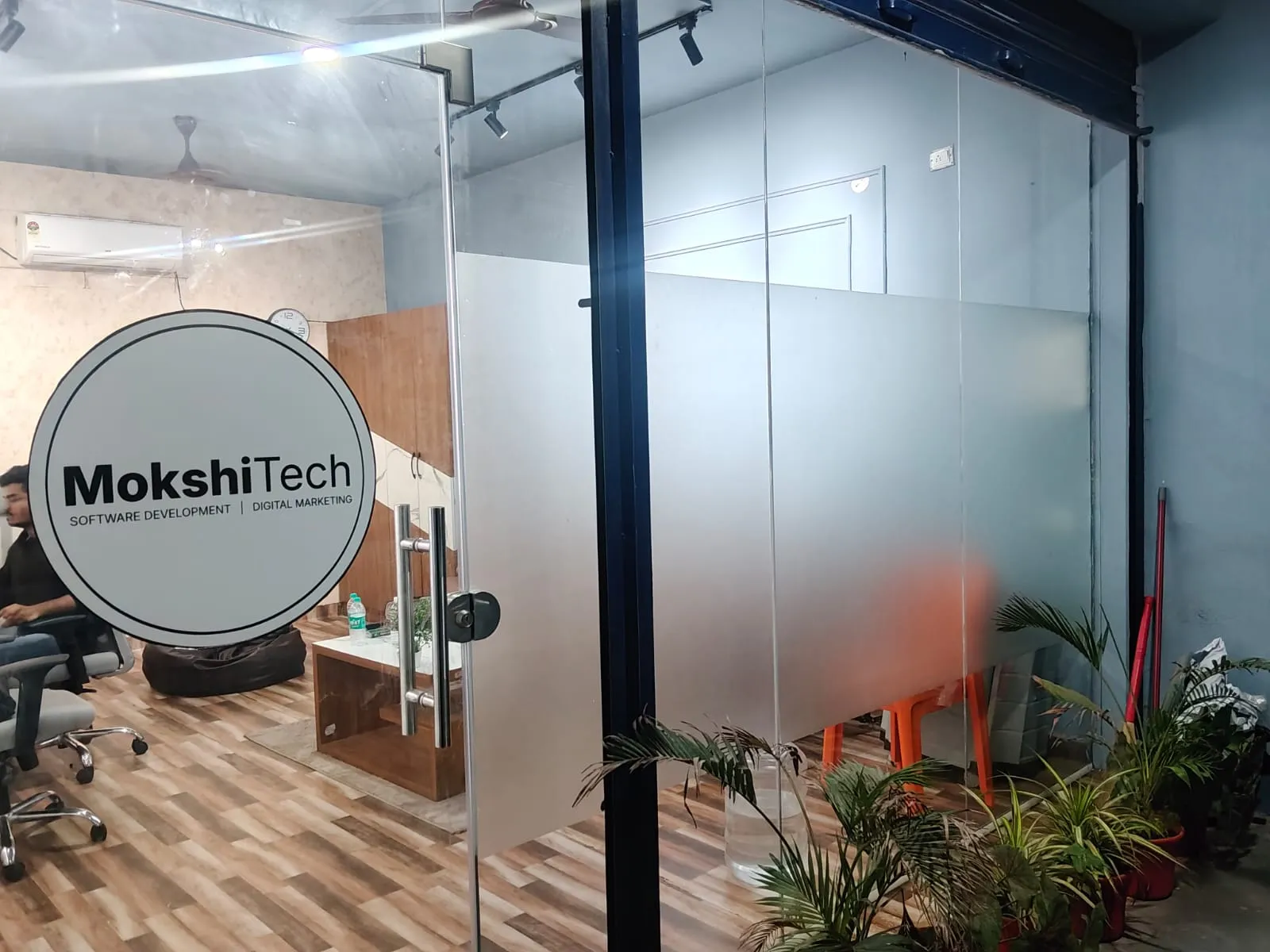 MokshiTech office entrance with a branded glass door in Ballari